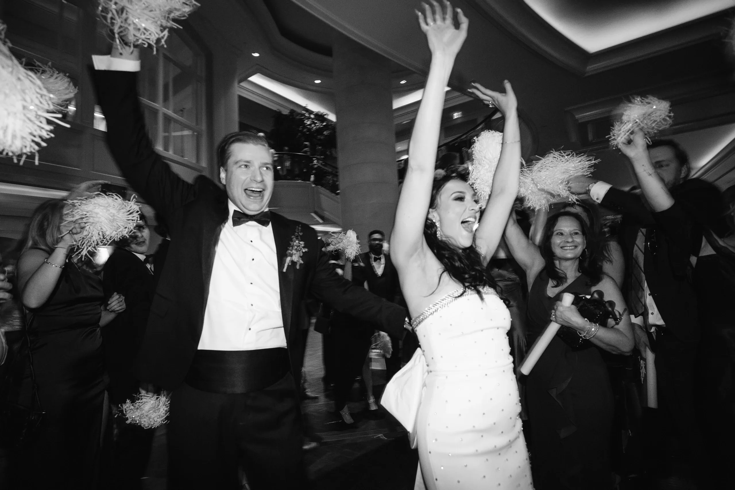 A couple celebrating with their wedding guests